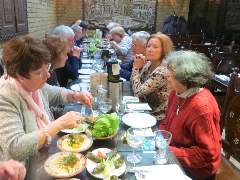 People seated at a table having a meal