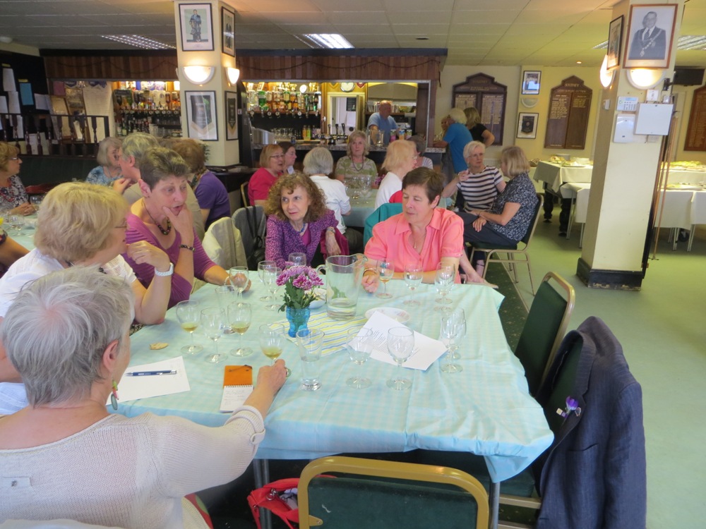 People seated at tables having a drink