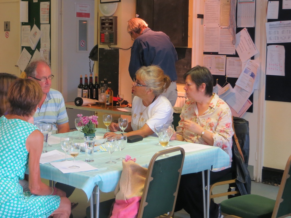 People seated at a table having a drink
