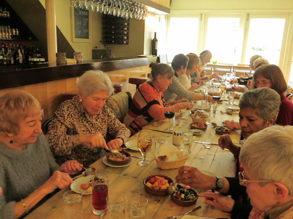 People seated at a table having a meal in a restaurant