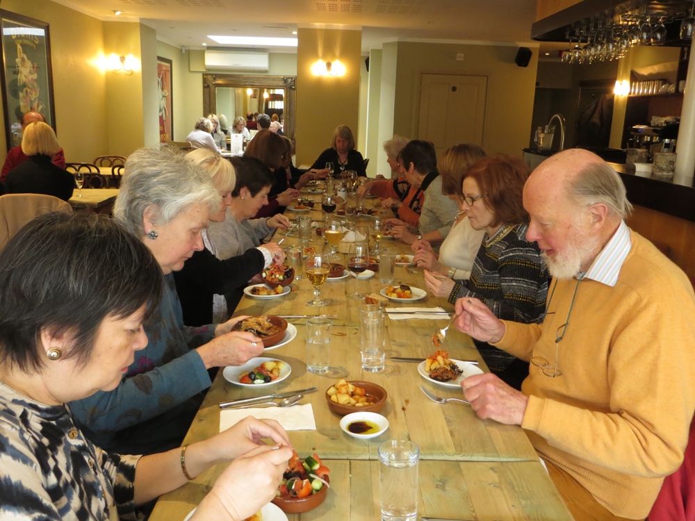 People seated at a table having a meal