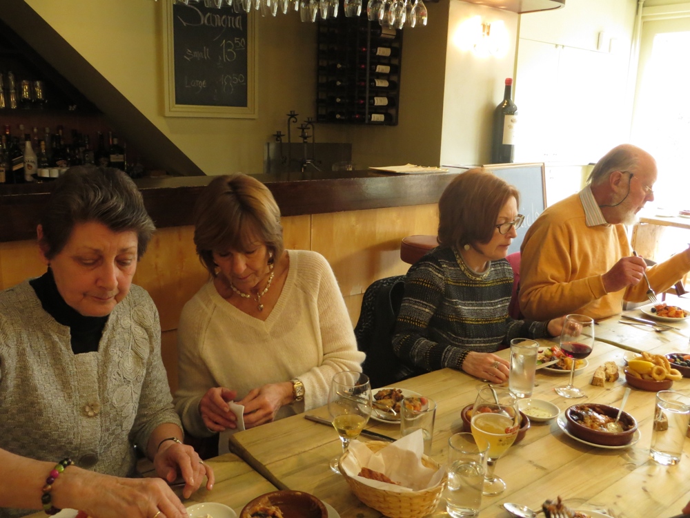 People seated at a table having a meal