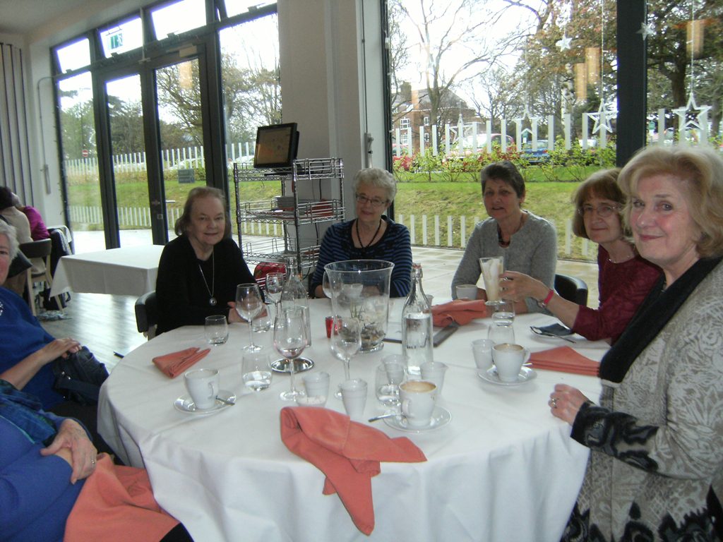 People seated around a table having a drink