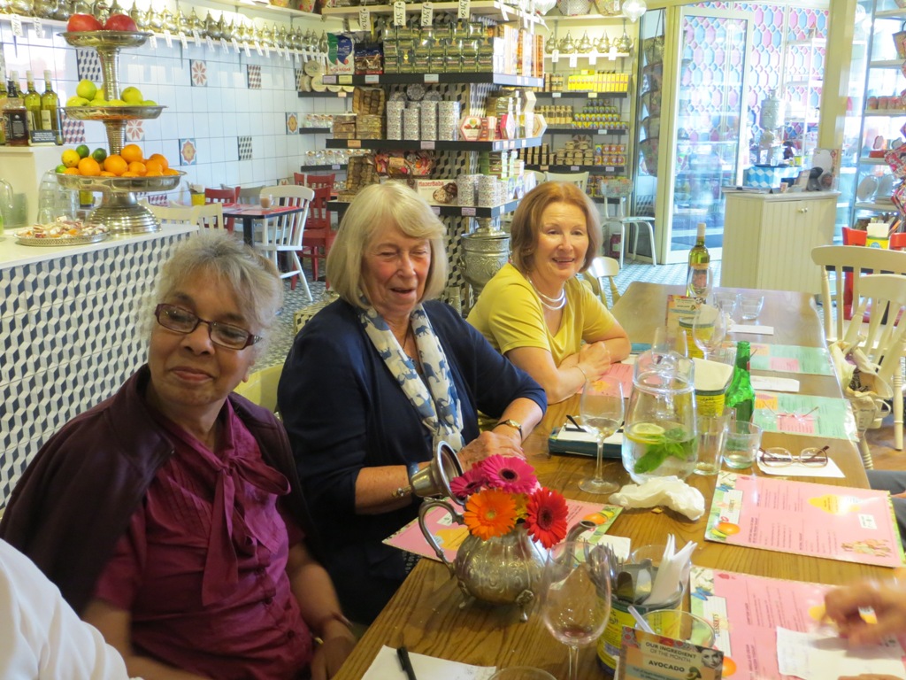 People seated at a table about to order a meal in a restaurant